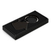 A black key ring in the shape of a house, presented in a sleek black box.
