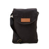 A black cooler bag with a flap closure and an adjustable shoulder strap, featuring a logo patch on the front.