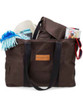 A brown tote bag with black straps, filled with a blanket, drinks, and other items. The bag features a logo.