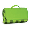 A green picnic blanket featuring a checkered pattern, neatly rolled and secured with a handle.
