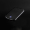 A black wireless charging power bank with a digital display showing battery percentage. It has a sleek, smooth design.