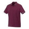 A burgundy short sleeve performance polo shirt featuring a contrasting collar and cuffs, with a logo on the chest.