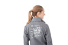 A grey women's packable rain jacket featuring a logo and graphic design on the back.