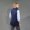A women's insulated puffer vest in navy, featuring a lightweight, packable design and a branded logo.