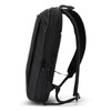 A black backpack featuring a sleek design, padded straps, and multiple zippered compartments. It has a logo on the front.