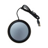 A round black USB cup warmer with a silver surface and a connected black cable.