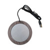 A round USB cup warmer with a wooden texture and metallic centre, featuring a black cable.