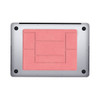 A slim laptop stand in coral pink with a textured surface and black accents. Features a logo on the base.