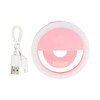 A pink LED selfie light with a circular design and a USB charging cable.