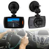 A dash cam with a black casing, mounted on a suction cup, showing a road view on its screen.