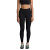 Black seamless leggings displayed on a model, paired with a matching crop top and athletic shoes. The image features branding.