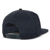 A black flat peak cap featuring a patch and an adjustable strap at the back.