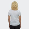 A white women's t-shirt from the back, featuring short sleeves and a fitted design. The model has wavy blonde hair.
