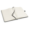 An open Petros Stone Paper Notebook in black, featuring lined pages and a matching ribbon bookmark.