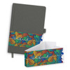 A grey notebook with a colourful leaf design on a band, accompanied by a matching envelope.