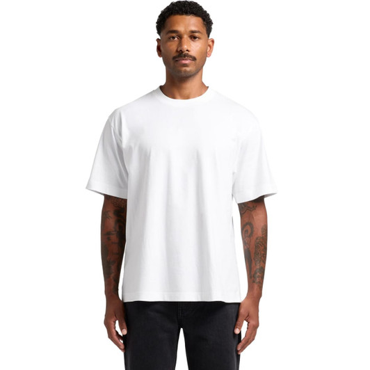 A white Box Tee, featuring a relaxed fit and short sleeves, displayed on a model with tattoos.