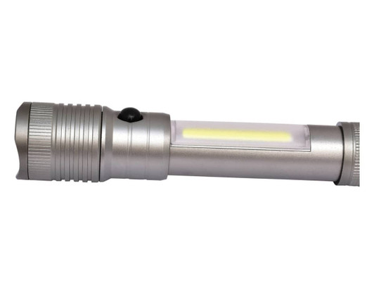 A gunmetal torch featuring a sleek design and a prominent light source in the centre. It has a logo on the body.