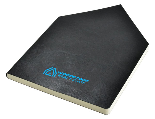 A black A5 notebook with a textured cover and a logo on the front.