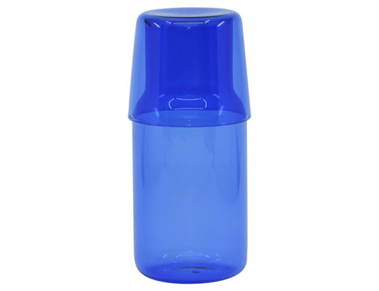 A drink bottle and tumbler set in vibrant blue glass, featuring a sleek design and a matching lid.