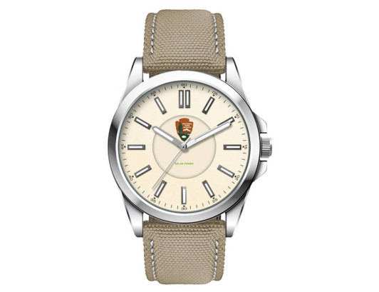 A unisex watch featuring a silver case, cream face, and a khaki rPET strap; includes a logo on the dial.