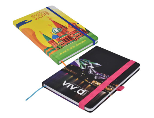 A vibrant, full-colour A5 notebook featuring a design related to Russia 2018 and another with a cityscape, both with elastic bands.