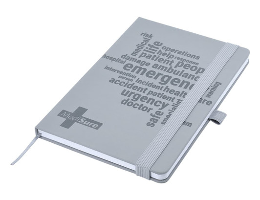 A grey A5 notebook with debossed text and an elastic band closure, featuring a logo on the cover.