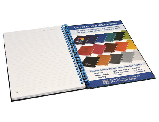 A side-bound A5 notebook with a blue spiral binding, featuring blank pages and a selection of colour options shown alongside.