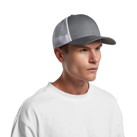 A grey Mesh Contrast Trucker Cap with a mesh backing and a curved peak, worn by a model in a white shirt.