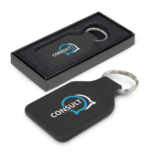 A square, black leather key ring with a metal keychain, presented in a sleek black box.
