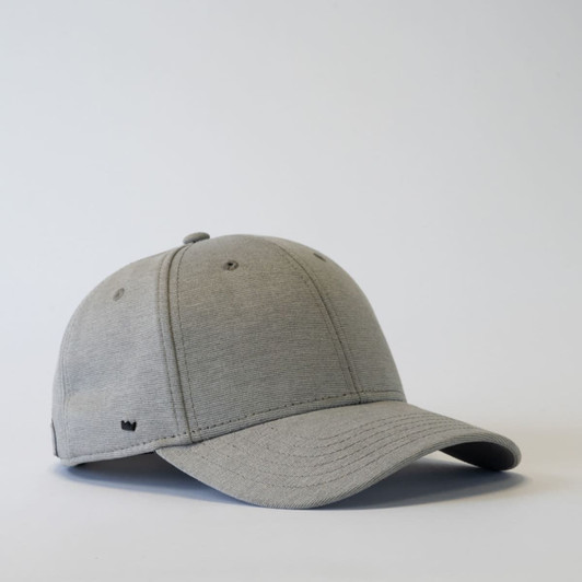 A grey 6-panel baseball cap with a curved brim and a logo on the side.
