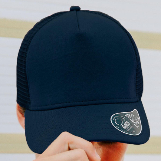 A navy trucker cap with a solid front and mesh back, featuring a branding logo on the side.