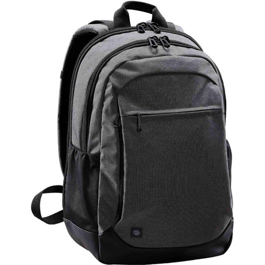 A grey backpack with black detailing, featuring multiple compartments and a logo on the front.