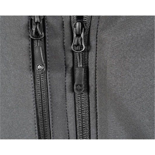 A close-up of a black ultra-light shell jacket, featuring dual zippers and a textured fabric. The jacket has a logo.