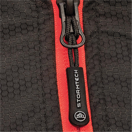 A close-up of a black thermal jacket featuring a contrasting red zipper and a branded pull tab.