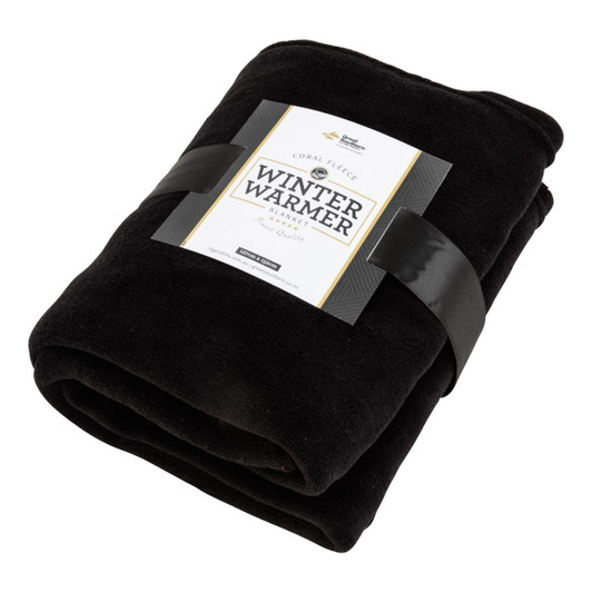 A black Coral Fleece blanket wrapped with a band featuring branding, showcasing its soft texture and warmth.