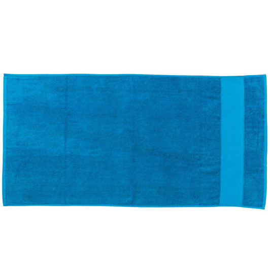 A large, rectangular beach towel in vibrant blue, featuring a solid colour design and a branding logo.