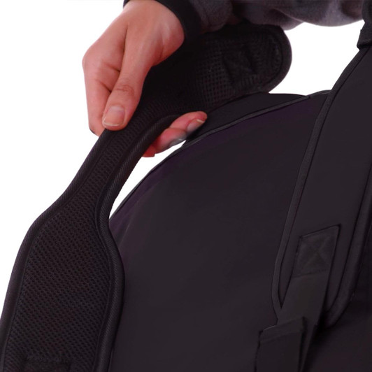 A person holds the padded handle of a black duffle bag featuring a logo. The bag has a sleek design.
