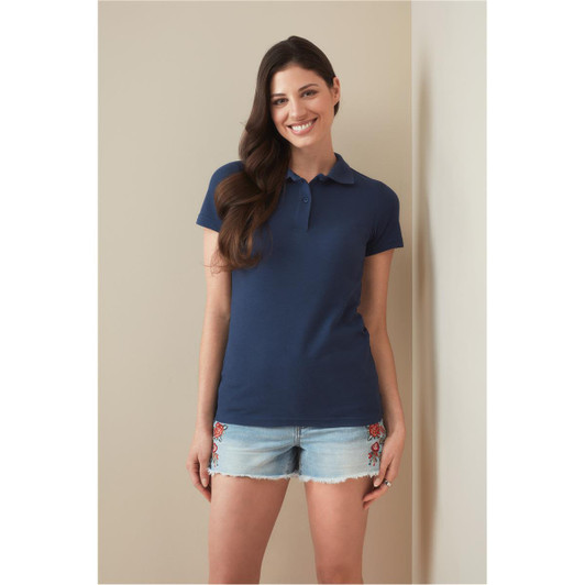 A women's heavyweight polo shirt in navy blue, featuring a classic collar and short sleeves. It has a logo detail.