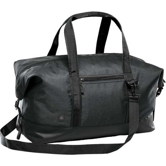 A black duffle bag with sturdy handles, a detachable strap, and a zippered front pocket, featuring a logo.
