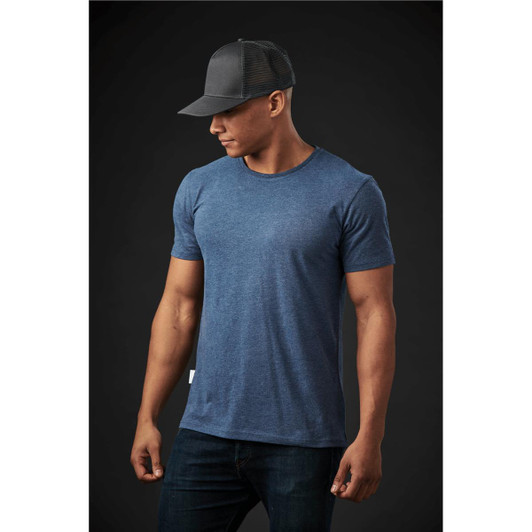 A blue crew neck t-shirt displayed on a male model, paired with a black cap and denim jeans.