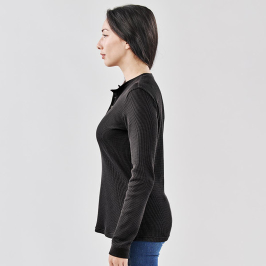 A black women's long-sleeve henley shirt, featuring a buttoned neckline and fitted silhouette.