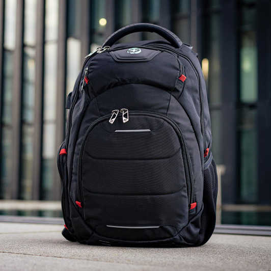 A black backpack with red accents, featuring multiple compartments and a logo on the front.
