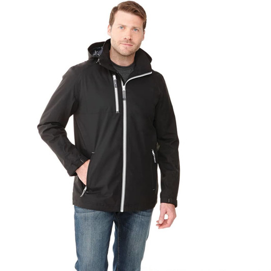 A man wearing a black rain jacket with a hood, featuring zippered pockets and a logo.