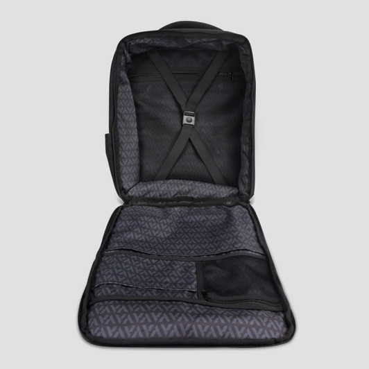An open black travel backpack with multiple compartments and a patterned inner lining. It features adjustable straps inside.