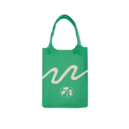 A large green knitted shoulder bag featuring a white wave design and a logo at the bottom.