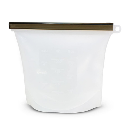 A white silicone reusable storage pouch with a bronze zip closure, featuring measurement markings.
