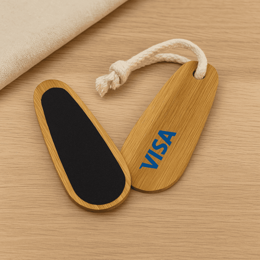 A bamboo paddle nail file featuring a black filing surface and a rope loop, with a logo on one side.