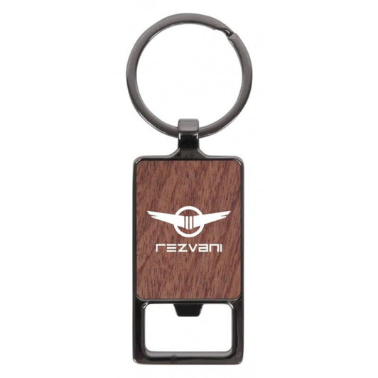 A rectangular keychain with a wood-like texture and a metal keyring. It features a logo on the front.