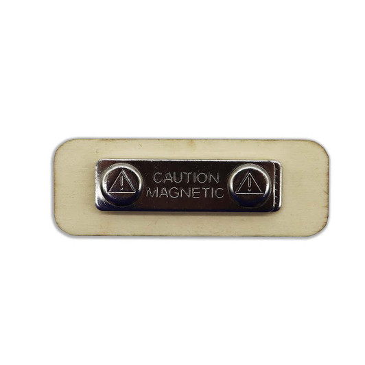 A rectangular wooden badge in beige with a silver magnetic clasp and a caution label.
