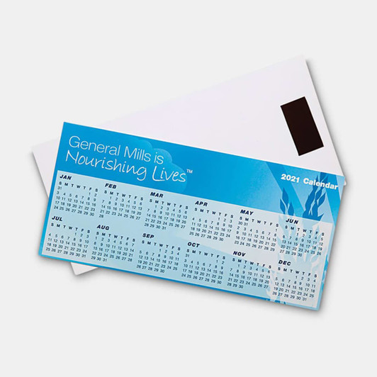 A blue magnetic calendar features monthly grids and is placed over a white envelope, showcasing a logo.